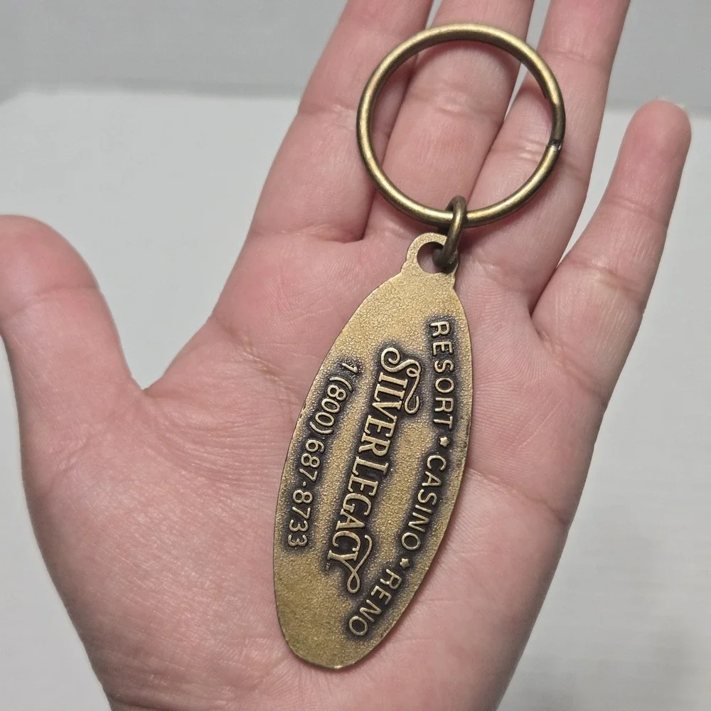 Vintage Silver Legacy Resort Casino Reno Nevada Brass Oval Souvenir Keychain Tag